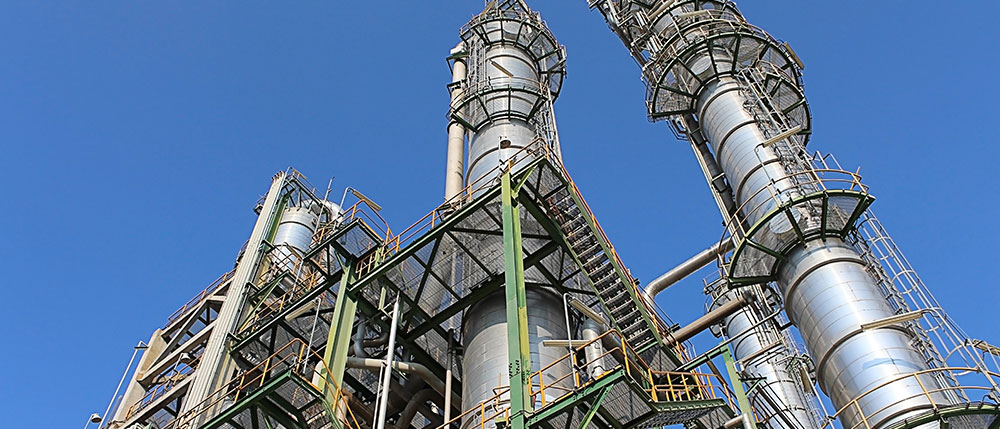 stock-photo-petroleum-and-chemical-plant-with-blue-sky-124940558